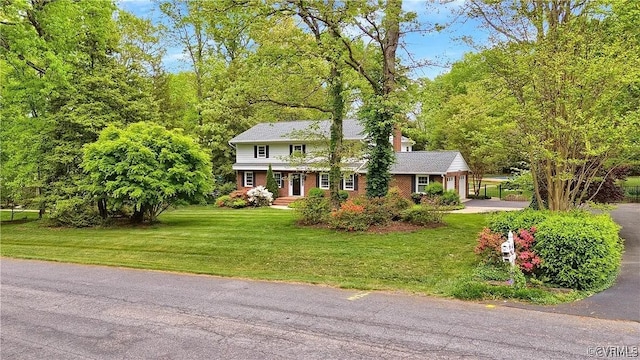 331 Harwick, North Chesterfield, VA 23236 - view of front facade with brick siding, driveway, a chimney, and a front lawn