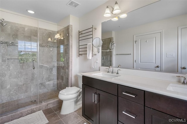 10925 Parkshire Ln, Henrico, VA 23233 - bathroom featuring tile patterned floors, a stall shower, double vanity, and toilet
