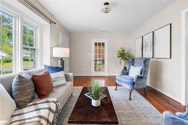 living room featuring baseboards and wood finished floors
