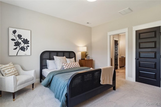 bedroom featuring light carpet, visible vents, and baseboards
