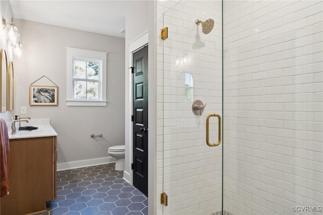 full bath featuring vanity, tile patterned flooring, a shower stall, and toilet