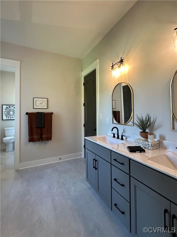 0 Three Chopt Rd, Gum Spring, VA 23065 - full bath featuring toilet, double vanity, tile patterned floors, and baseboards