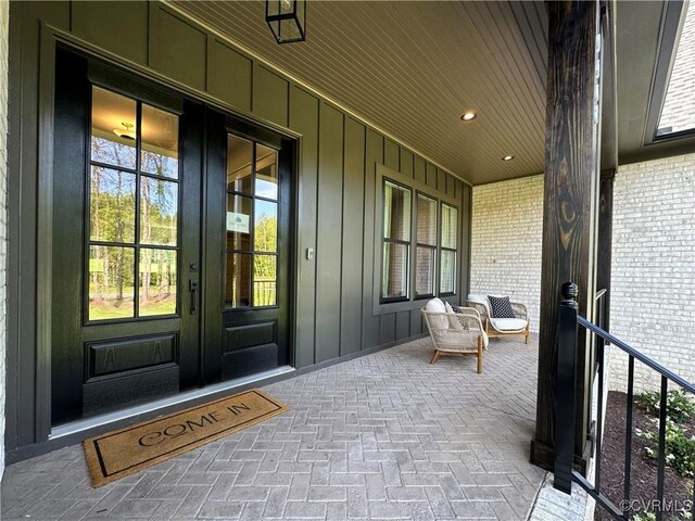 0 Three Chopt Rd, Gum Spring, VA 23065 - entrance to property featuring french doors, board and batten siding, and brick siding