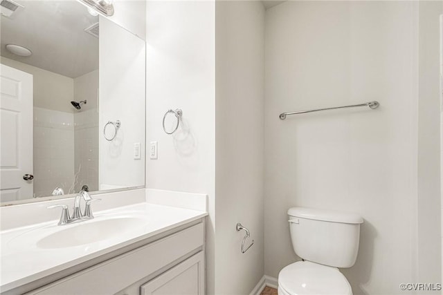 full bathroom featuring vanity, walk in shower, baseboards, toilet, and visible vents