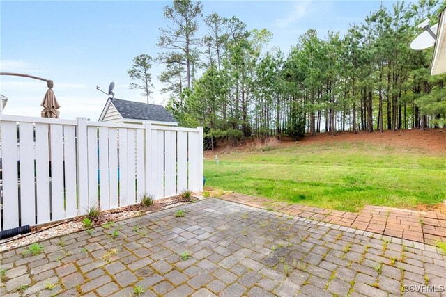 view of patio featuring fence