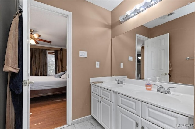 bathroom featuring a sink, double vanity, connected bathroom, and visible vents