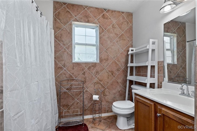 full bathroom with vanity, tile patterned floors, toilet, and a shower with curtain