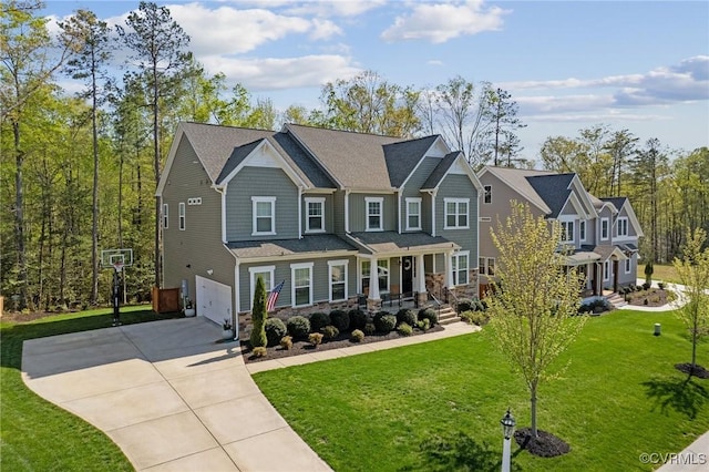 craftsman inspired home with a porch, an attached garage, stone siding, concrete driveway, and a front yard