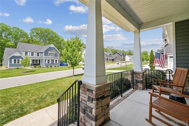 view of patio / terrace featuring a porch and a residential view