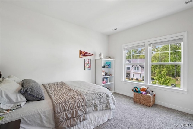 bedroom with carpet, baseboards, and visible vents