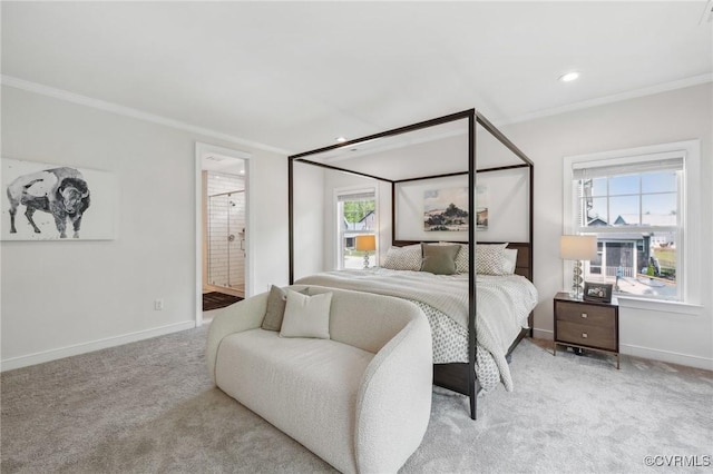 bedroom with light colored carpet, crown molding, connected bathroom, and baseboards