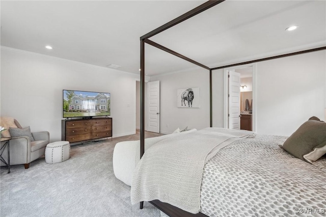 carpeted bedroom with crown molding, connected bathroom, and recessed lighting