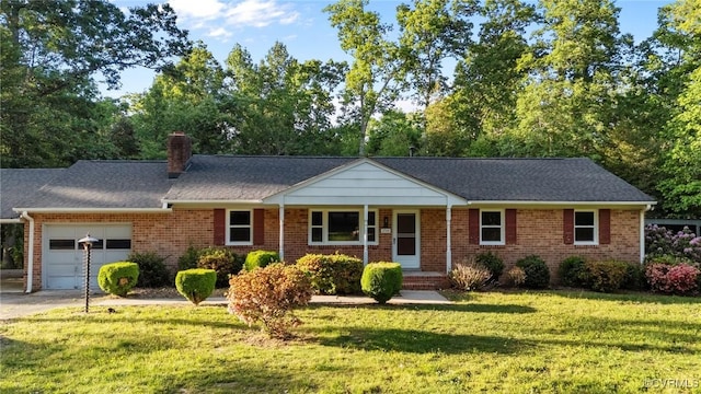 ranch-style house with brick siding, a garage, driveway, and a front yard