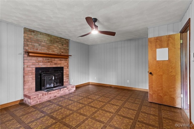 unfurnished living room with baseboards, ceiling fan, and tile patterned floors