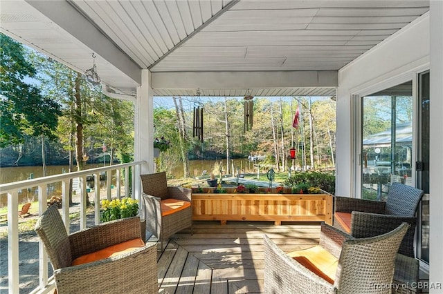 sunroom with a water view