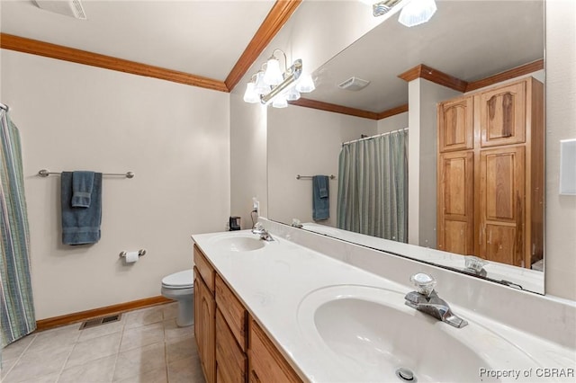 bathroom featuring baseboards, ornamental molding, a sink, and visible vents