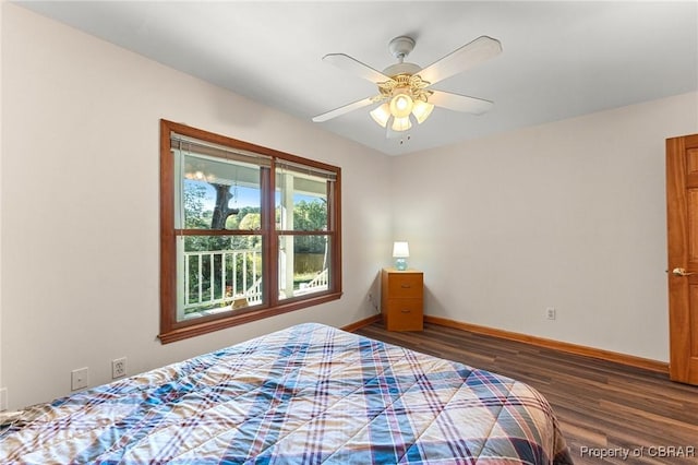 bedroom featuring ceiling fan, baseboards, and dark wood-style flooring