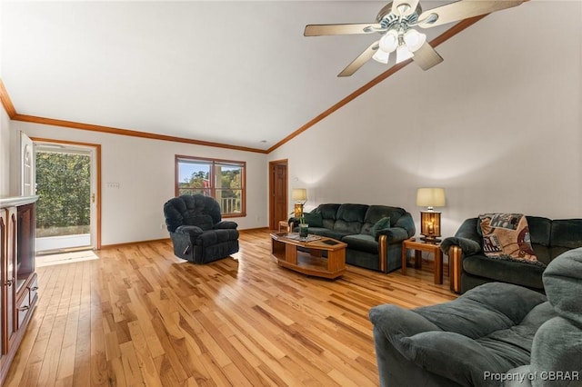 living area with vaulted ceiling, a ceiling fan, light wood-style floors, baseboards, and ornamental molding