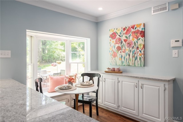 dining room featuring recessed lighting, visible vents, ornamental molding, and dark wood-type flooring