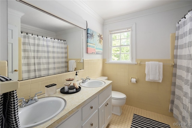 bathroom with a sink, tile walls, tile patterned flooring, and toilet