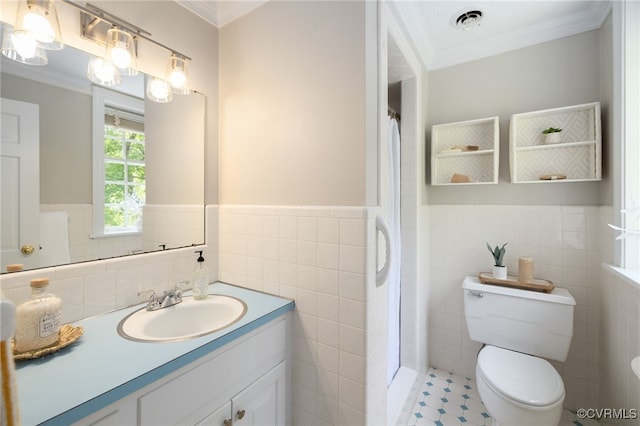 bathroom with toilet, tile walls, and ornamental molding