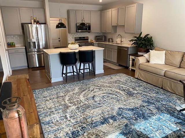 1900 Roseneath Rd Unit 4B, Richmond, VA 23230 - kitchen with a sink, open floor plan, gray cabinetry, and stainless steel appliances