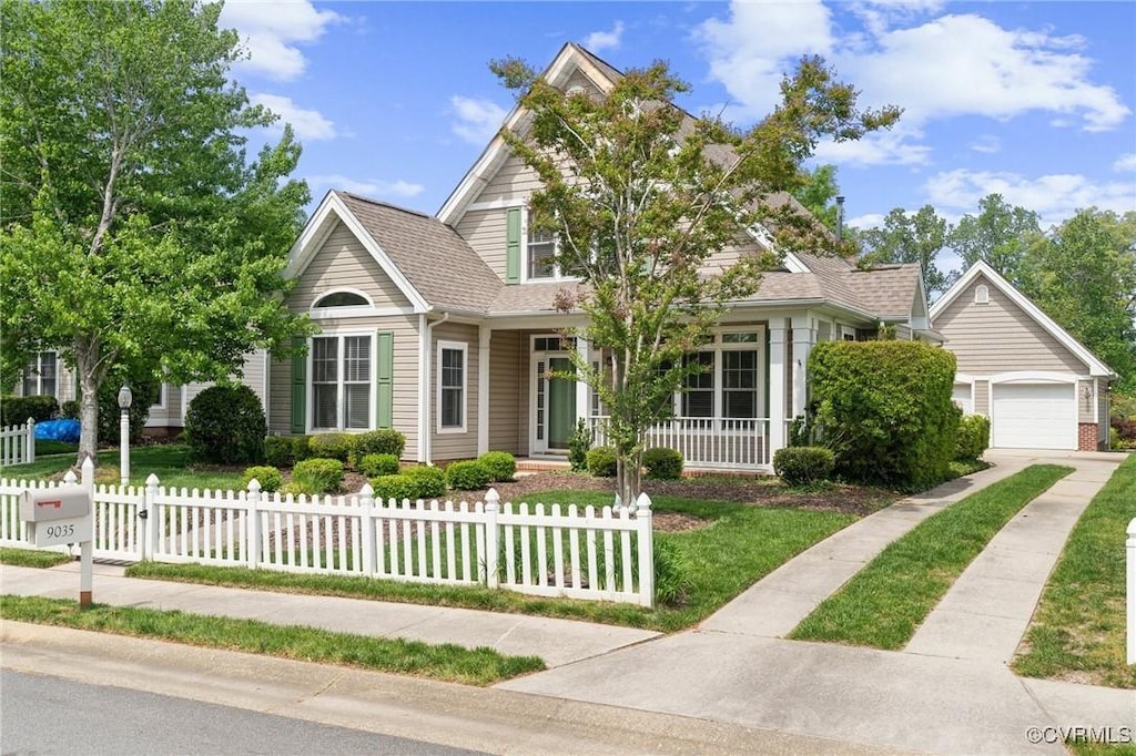 9035 Planters Xing, Toano, VA 23168 - view of front of house featuring a fenced front yard, a front lawn, and covered porch