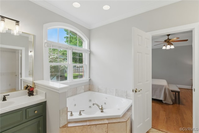 full bathroom featuring a whirlpool tub, vanity, connected bathroom, crown molding, and ceiling fan