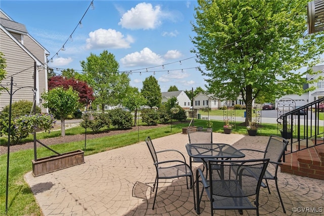 view of patio / terrace with outdoor dining area and a residential view