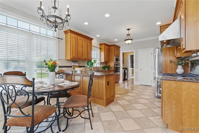 kitchen with range hood, backsplash, a peninsula, ornamental molding, and recessed lighting