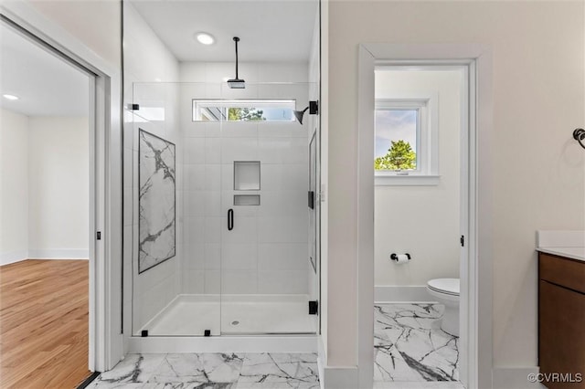 810 N 32nd St, Richmond, VA 23223 - bathroom with a shower stall, baseboards, marble finish flooring, toilet, and vanity