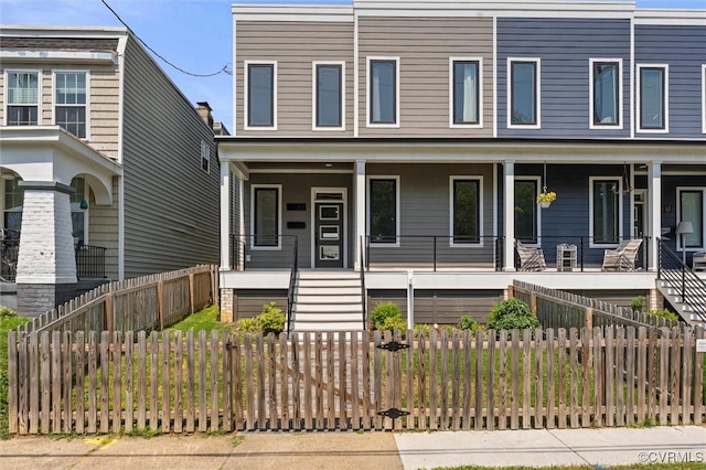 810 N 32nd St, Richmond, VA 23223 - view of front of house featuring a porch, stairway, and a fenced front yard