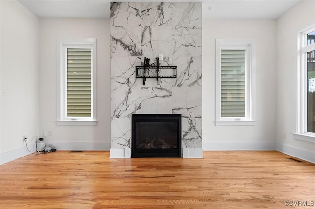 810 N 32nd St, Richmond, VA 23223 - detailed view of a high end fireplace, wood finished floors, and baseboards