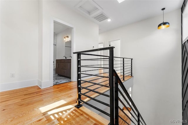 810 N 32nd St, Richmond, VA 23223 - stairs featuring wood finished floors, attic access, and baseboards