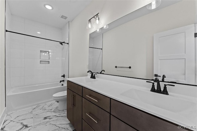 810 N 32nd St, Richmond, VA 23223 - full bathroom featuring toilet, marble look tiles, double vanity, recessed lighting, and  shower combination