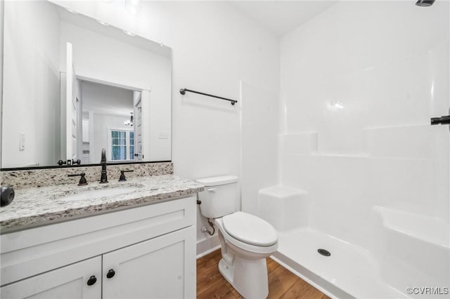 2355 Cedar Hill Rd, Mineral, VA 23117 - bathroom featuring toilet, walk in shower, vanity, and wood finished floors