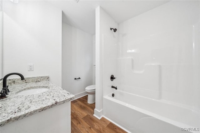 2355 Cedar Hill Rd, Mineral, VA 23117 - bathroom featuring wood finished floors, toilet, vanity, baseboards, and shower / tub combination