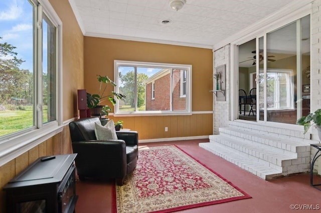 sunroom / solarium with a healthy amount of sunlight and visible vents