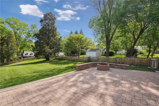 view of patio / terrace featuring a fenced backyard and an outdoor fire pit