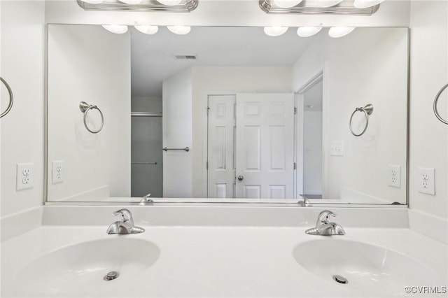 full bathroom featuring vanity and visible vents