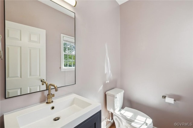 bathroom with toilet and vanity