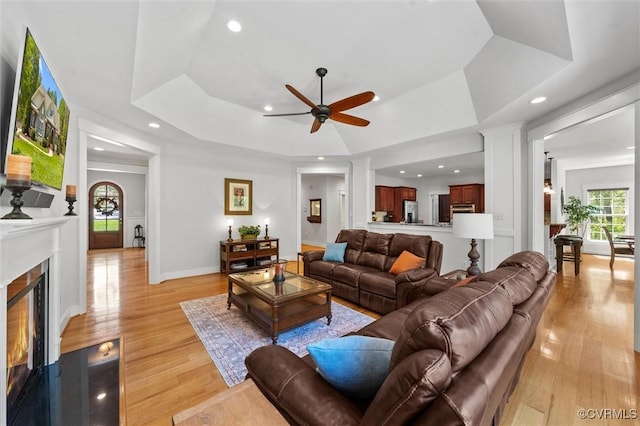 12712 Dell Hill Ct, Chesterfield, VA 23831 - living room with light wood finished floors, a ceiling fan, a tray ceiling, and recessed lighting