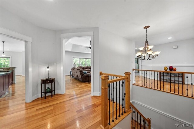 12712 Dell Hill Ct, Chesterfield, VA 23831 - corridor with light wood-type flooring, baseboards, a notable chandelier, and an upstairs landing