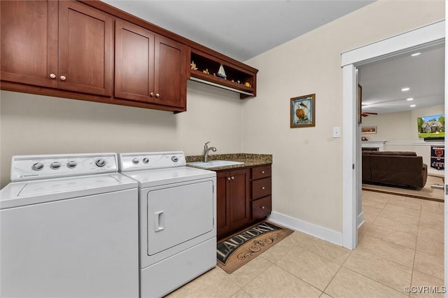 12712 Dell Hill Ct, Chesterfield, VA 23831 - laundry area featuring washer and clothes dryer, a sink, light tile patterned floors, cabinet space, and baseboards