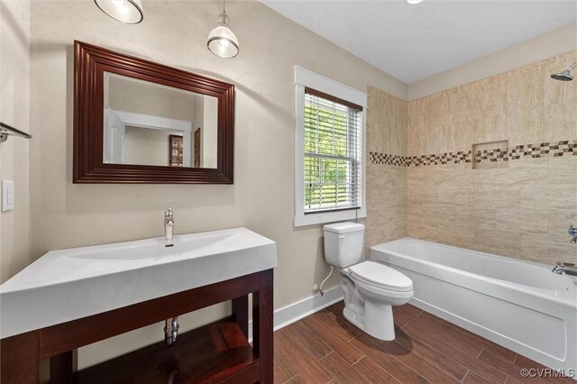 12712 Dell Hill Ct, Chesterfield, VA 23831 - bathroom featuring shower / washtub combination, wood finished floors, toilet, vanity, and baseboards