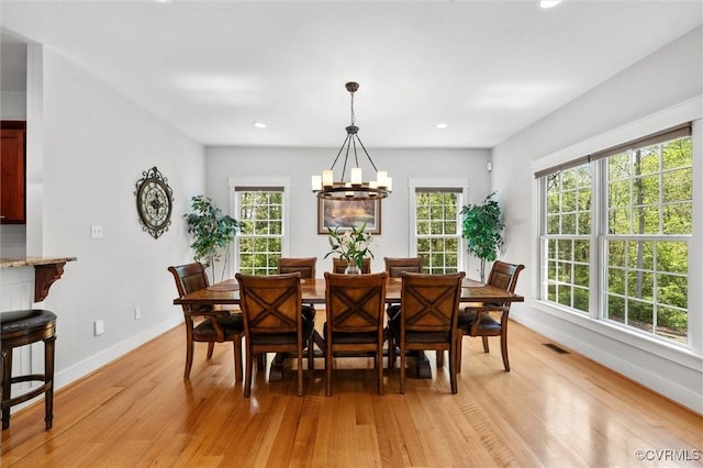 12712 Dell Hill Ct, Chesterfield, VA 23831 - dining room featuring plenty of natural light, baseboards, a notable chandelier, and light wood-type flooring