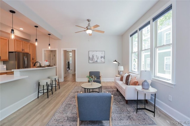6 S Rowland St, Richmond, VA 23220 - living room featuring baseboards, a ceiling fan, and light wood-style flooring