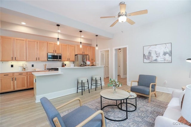 6 S Rowland St, Richmond, VA 23220 - living area with recessed lighting, light wood-style floors, a ceiling fan, and baseboards