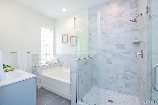 6 S Rowland St, Richmond, VA 23220 - full bathroom featuring a shower stall, a garden tub, tile patterned floors, and vanity