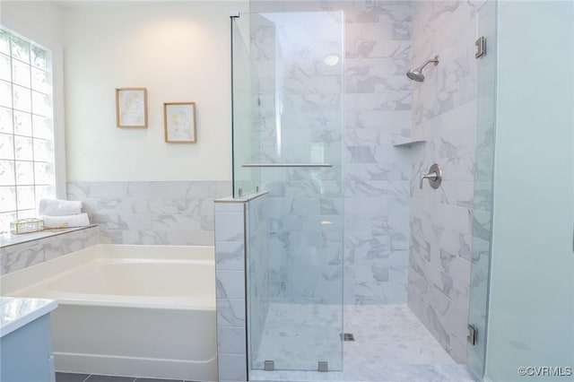 6 S Rowland St, Richmond, VA 23220 - full bathroom featuring a garden tub, vanity, and a stall shower
